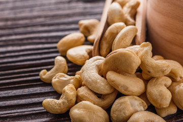 cashew nuts on a rustic wooden background