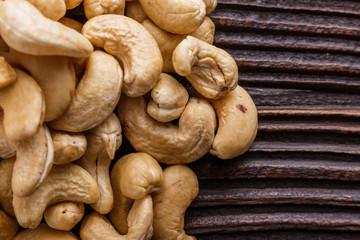 cashew nuts on a rustic wooden background