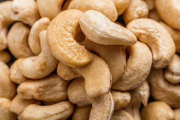cashew nuts on a rustic wooden background