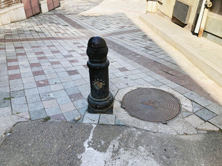 TBILISI, GEORGIA - JULY 07, 2018: Gunner ornamental cast iron bollard in Tbilisi, Georgia