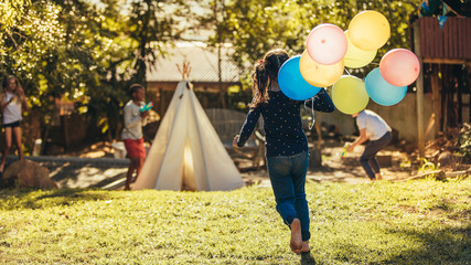 Children playing together in backyard