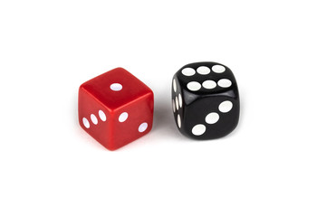 Two dice isolated on white background. Red one and black six.