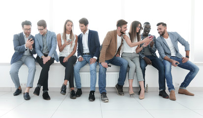 Fototapeta premium group of young people communicate in the waiting room.