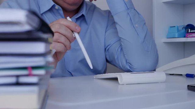 Impatiently Businessman Make Restless Gestures with a Pencil on the Desk Surface