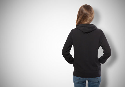 young girl in black sweatshirt, black hoodies view isolated on white background.