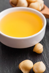 delicious macadamia nuts on a dark stone background