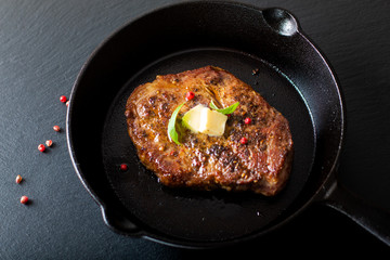 Food concept grilled Marinat Sirloin meat steak in Cast-Iron Skillet pan with copy space