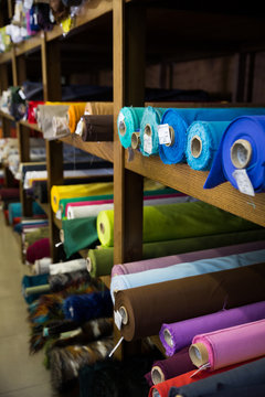 Rolls of fabric and textiles in shop