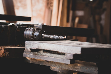 Carpenter working with circular saw woodworking machine in a carpentry