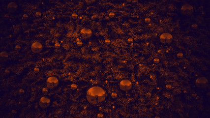 Christmas decorations. Shiny orange balls on a deep blue Christmas tree