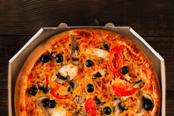 pizza, mushrooms, olives, chicken, tomato sauce, cheese, (pizza ingredients). hot pizza. food background. copy space