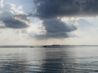 Naklejka na ściany i meble Beautiful Cumulus clouds over the ocean in Maldives