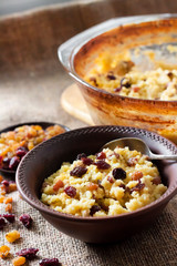 Sweet millet porridge with raisins and dried cranberries