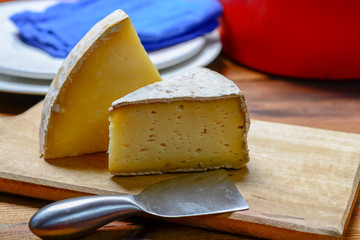 Pieces of French Tomme and Cantal cheese, close up