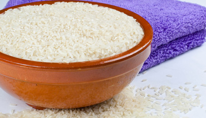 Obraz na płótnie Canvas Bowl of rice and kitchen towel detail