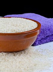 Bowl of rice and kitchen towel detail