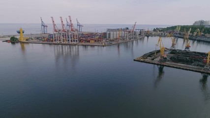 Aerial of industrial seaport with big cranes and platforms in Odessa in summer