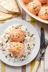 Chicken meatballs in creamy tomato sauce with rice