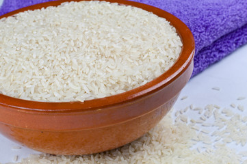 Bowl of rice and kitchen towel detail