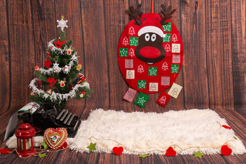 Christmas dark wood background with Christmas tree, advent calendar and  typewriter
