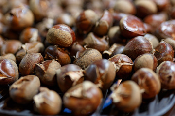 Roasted chestnuts on grill closeup