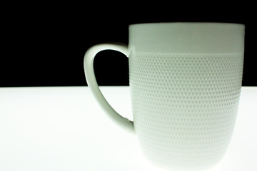 cup on white and black background