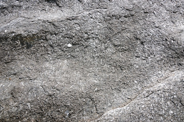 The surface texture of natural stone blocks.