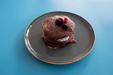 black moon cake with white cream.