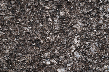 Surface texture of natural stone with sequins.