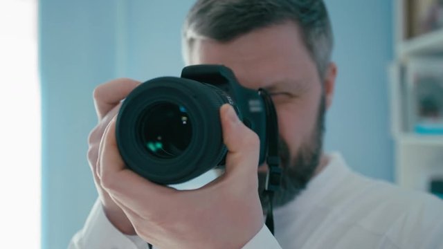 Male Dentist Doctor is Taking a Picture by Professional Camera for Dental Photography Report
