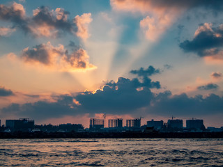 Sunrise and the silhouette of the skyline of Male in the Maldives