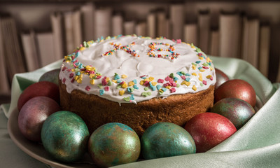 easter cake and eggs on wooden table