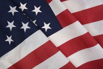 Obraz premium Closeup of an American Flag with folds, for patriotic holiday