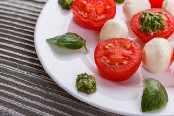 Caprese salad on a wooden rustic background