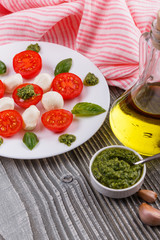 Caprese salad on a wooden rustic background
