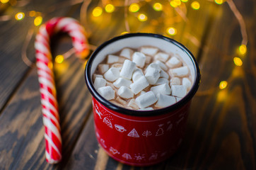 Red mug with hot chocolate with melted marshmallow