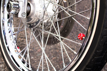 Fototapeta na wymiar motorcycle tire with an interesting touch of a red dice