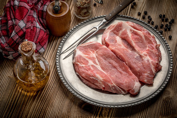 Slices of raw pork neck.