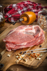 Slices of raw pork neck.