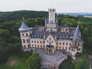 Fototapeta premium View of Marienburg Castle, a Gothic revival castle in Lower Saxony, Germany, near Hanover, drone aerial view