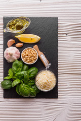 Ingredients for pesto sauce on the kitchen board