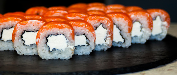 beautiful sushi, rolls, with caviar and fresh fish, close-up