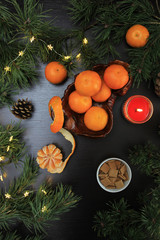 Mandarins in flat lay. Mandarins in still life composition for christmas.  Clementines and christmas decorations