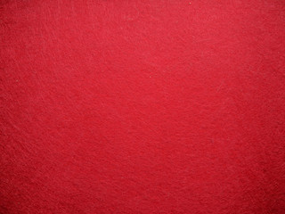 Abstract background with a red texture of felt fabric