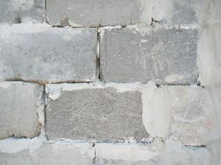 Texture of a gray concrete wall scatter of small crumbs