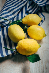 fresh lemons with green leaves