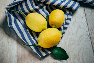 fresh lemons with green leaves