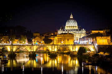 Obraz na płótnie Canvas Vatican City: Saint Peter with bridge reflection by night