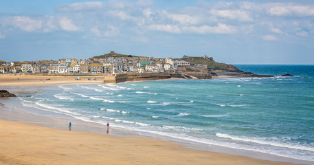 Harbour at St Ives with waves crashing against the harbour wall taken in St Ives, Cornwall, UK on...