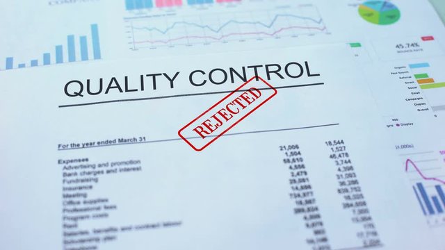Quality control rejected, hand stamping seal on official document, statistics